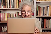 Elderly lady using a laptop