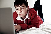 Boy using a laptop computer