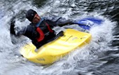 Kayaker paddling on a river