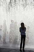 Teenagers playing in a fountain