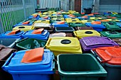 Used and damaged wheelie bins in compound