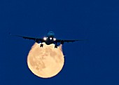 Airbus 330 passing in front of the moon