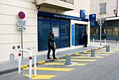 Security parking outside a bank