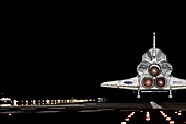 Space shuttle landing at night