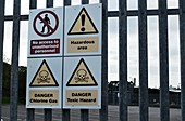 Hazard warning signs outside factory