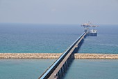 Ship unloads coal at the pier