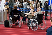 Airline passengers in wheelchairs