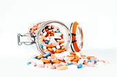 Assorted pills in a jar
