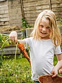 Girl holding carrot