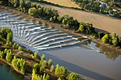 Surfers on the Garonne tidal bore