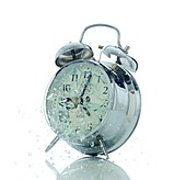 Bullet hits alarm clock,high-speed image