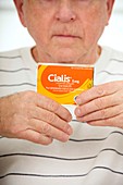 Elderly man with cialis tablets
