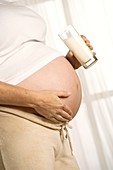 Pregnant woman drinking milk