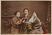 Photograph of three Japanese women readin