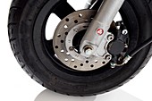 Scooter wheel and brake pad