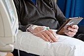 Chemotherapy patient with e-book