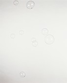 Nine soap bubbles floating in the air