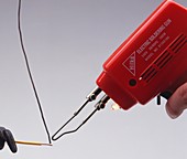 Electrical soldering iron with solder