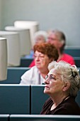 Senior citizens learning to use computers