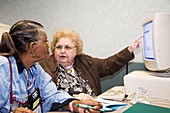 Senior citizen learning to use computer