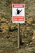 Quicksand warning sign