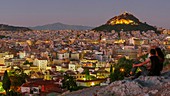 Couple looking out over Athens,Greece