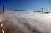 Mist-shrouded bridge,Detroit River