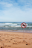 No swimming sign on a beach