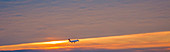 Passenger airliner landing at dawn
