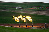 Gas flares at an oil field