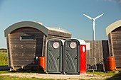 Log cabins and a wind turbine