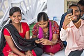 Young women check there mobile phone