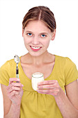 Woman holding a yoghurt