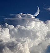 Crescent Moon in cloudy sky