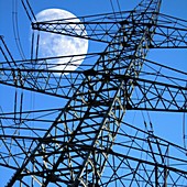 Moon behind electricity pylons