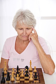 Older lady playing chess