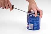 Opening a can with a lever