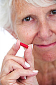 Elderly woman with medication