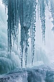 Icicles on freezing waterfall
