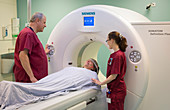 Radiographers preparing a CT scan