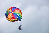 Tourists parasailing off Green Island