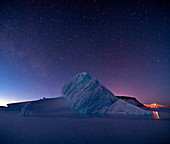 Night sky over iceberg,Greenland