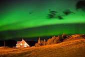 Northern lights over a house
