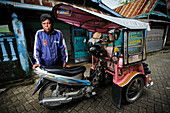 Rickshaw driver with leprosy,Indonesia