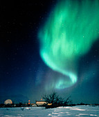 Aurora Borealis and satellite station in