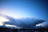 Cumulonimbus anvil cloud seen approaching town
