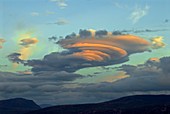 Sunlit lenticular clouds