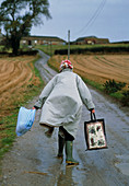 View of an elderly woman caught in storm