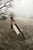 Man battling hurricane Katrina