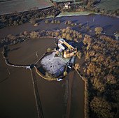 Farmhouse encircled by flood waters